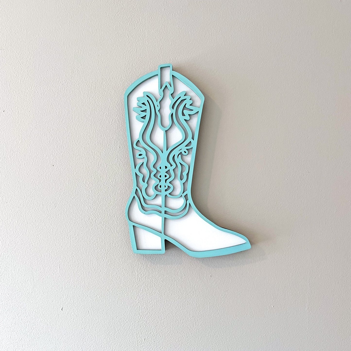 Aqua and white cowgirl boot wall decor.