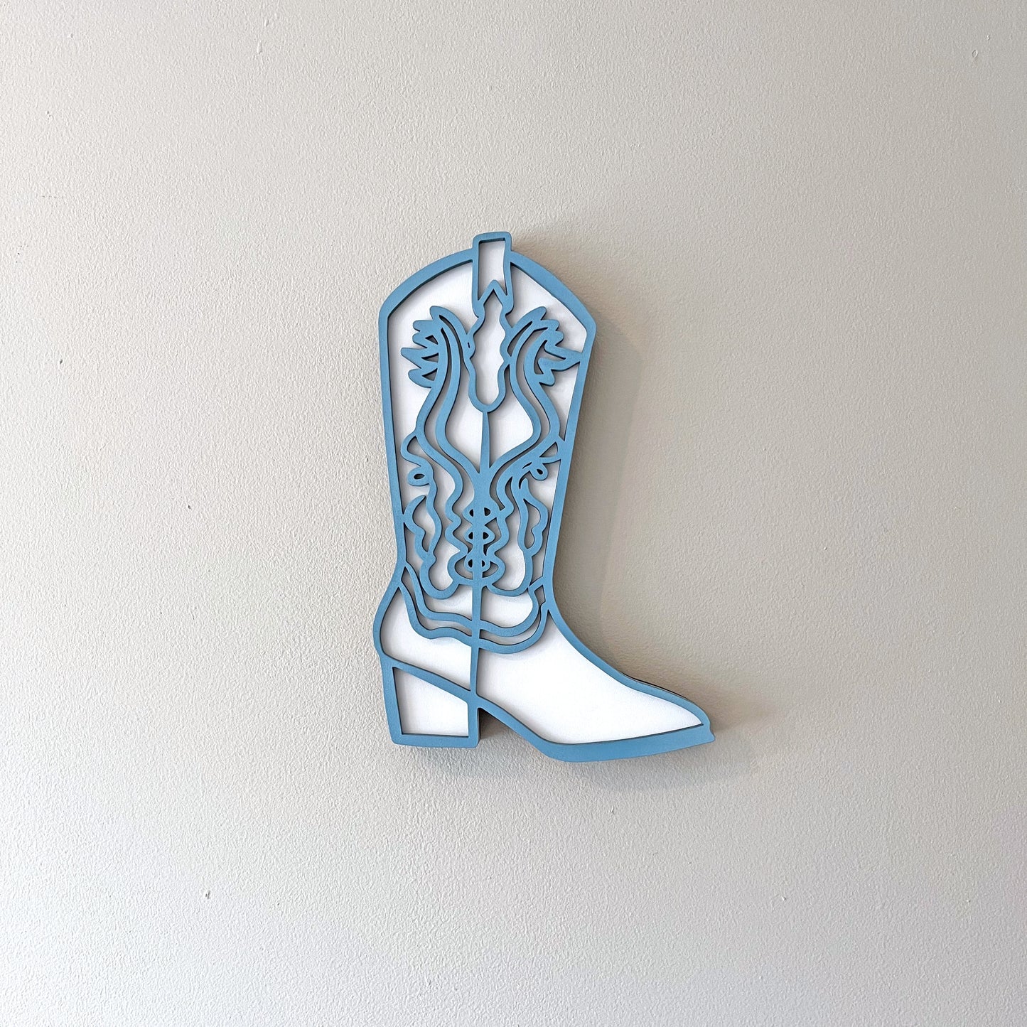 Blue and White cowgirl boot wall decor.