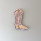 Pink and natural cowgirl boot wall decor.